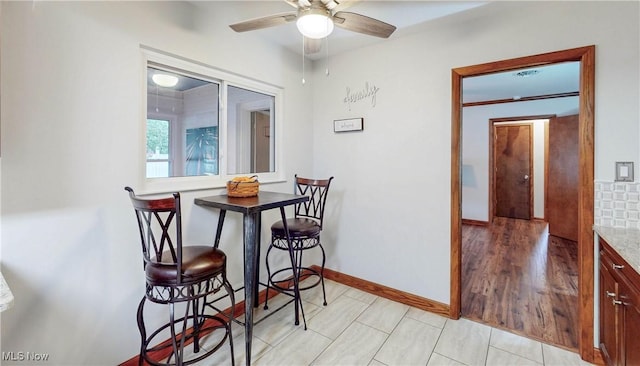 891 Sovereign Rd, Akron, OH 44303 - dining space featuring ceiling fan and baseboards