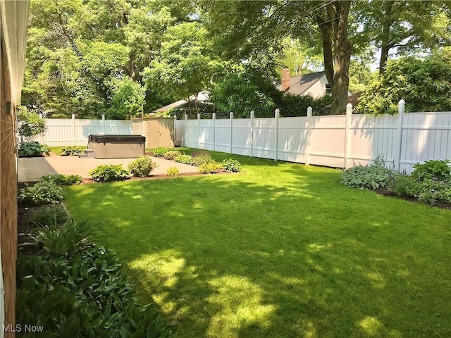 891 Sovereign Rd, Akron, OH 44303 - fenced backyard with a hot tub and a patio