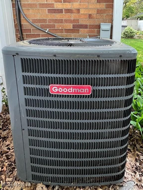 891 Sovereign Rd, Akron, OH 44303 - exterior view of a central air condition unit and brick siding
