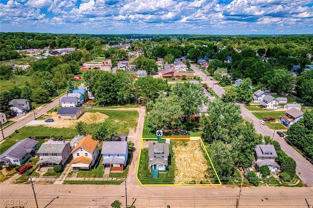 2021 17th St NE, Canton, OH 44705 - aerial view of residential area with property parcel outlined and a tree filled landscape