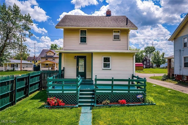 2021 17th St NE, Canton, OH 44705 - rear view of house with a chimney and a porch