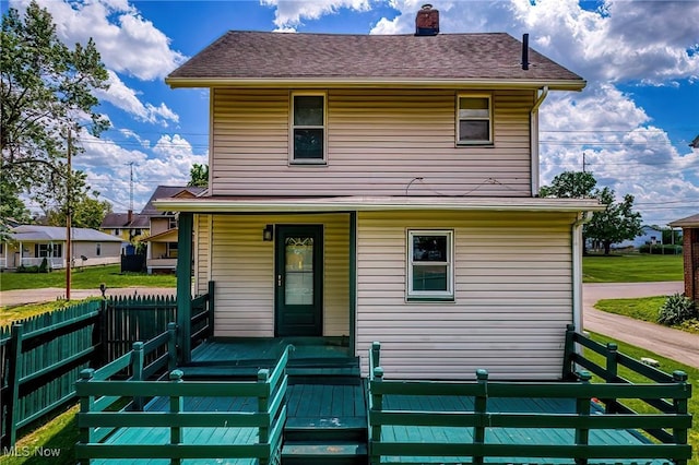 2021 17th St NE, Canton, OH 44705 - back of house featuring covered porch, a chimney, and fence