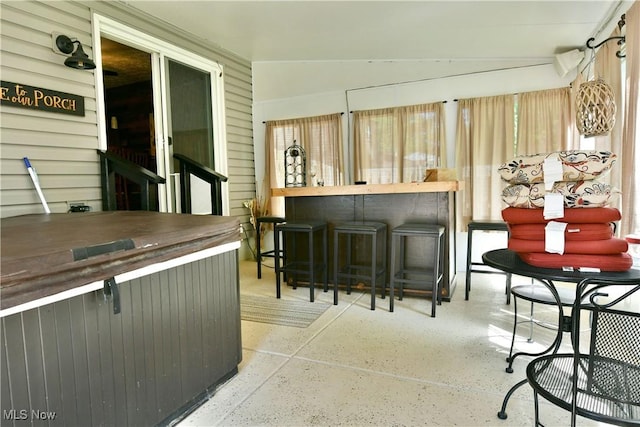 indoor dry bar featuring speckled floor