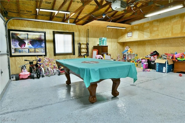 recreation room featuring pool table, wood walls, and speckled floor