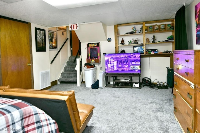 carpeted bedroom featuring a paneled ceiling