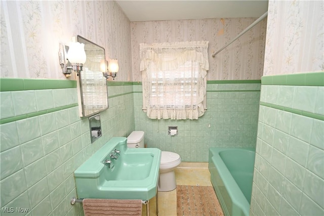 252 Rosemont Ave, Youngstown, OH 44515 - full bathroom featuring wallpapered walls, a bath, tile walls, toilet, and a shower