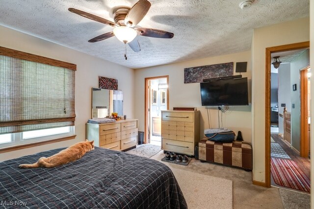 75 River Ridge Lane, Munroe Falls, OH 44262 - carpeted bedroom featuring a textured ceiling and a ceiling fan