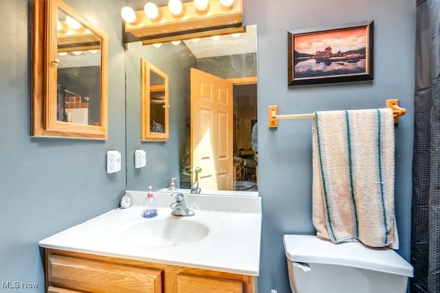 75 River Ridge Lane, Munroe Falls, OH 44262 - bathroom featuring vanity and toilet