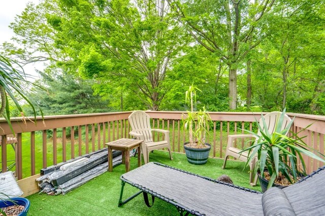 75 River Ridge Lane, Munroe Falls, OH 44262 - wooden terrace featuring a lawn