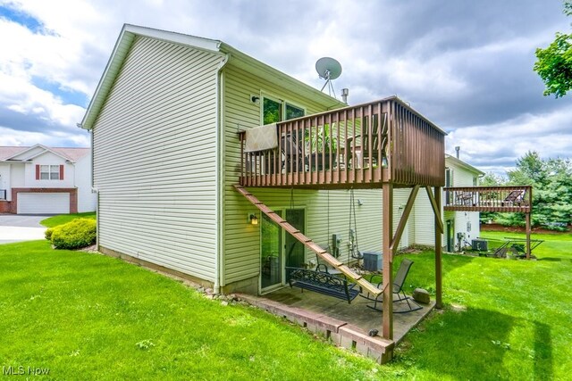 75 River Ridge Lane, Munroe Falls, OH 44262 - view of side of property with a deck, a yard, and central air condition unit