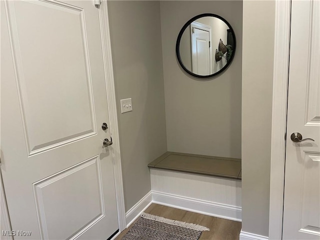 mudroom featuring baseboards and wood finished floors