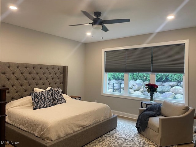 bedroom featuring wood finished floors, recessed lighting, baseboards, and ceiling fan