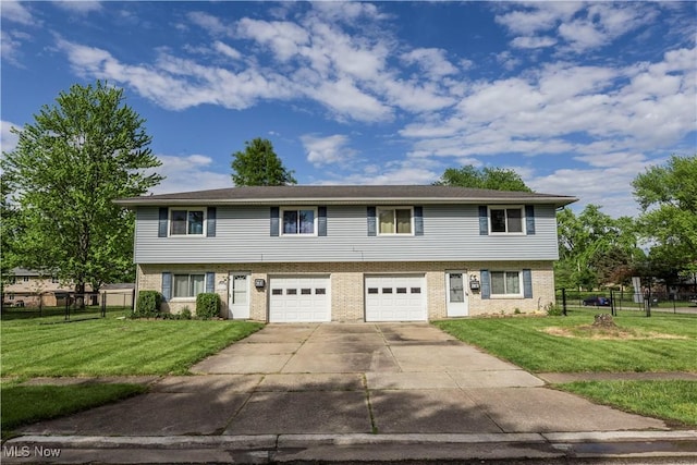 4697-4701 Maple Spur Dr, Stow, OH 44224 - townhome / multi-family property featuring brick siding, an attached garage, and concrete driveway