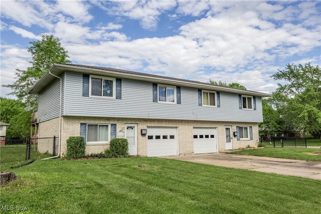 4697-4701 Maple Spur Dr, Stow, OH 44224 - multi unit property featuring brick siding, a garage, and driveway