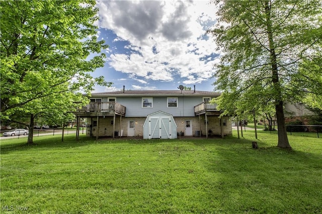4697-4701 Maple Spur Dr, Stow, OH 44224 - rear view of property featuring a wooden deck, brick siding, a storage shed, an outdoor structure, and central AC