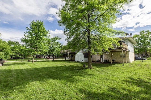 4697-4701 Maple Spur Dr, Stow, OH 44224 - view of grassy yard featuring a shed, an outbuilding, and a wooden deck