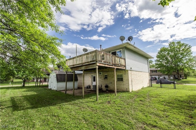 4697-4701 Maple Spur Dr, Stow, OH 44224 - rear view of property with a storage unit, a deck, an outbuilding, brick siding, and a patio area