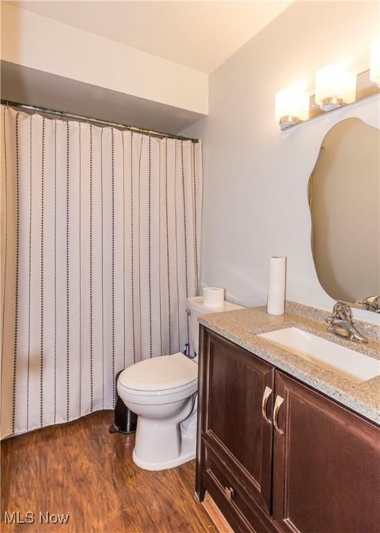 4697-4701 Maple Spur Dr, Stow, OH 44224 - full bathroom with wood finished floors, vanity, and toilet