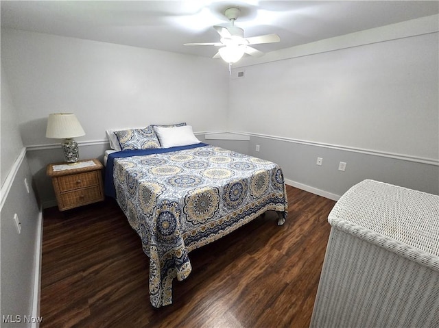 bedroom featuring wood finished floors, ceiling fan, and baseboards