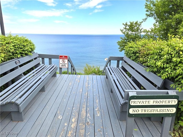 deck featuring a water view