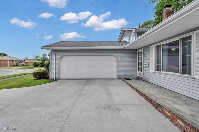 3226 Woodlawn Dr, Parma, OH 44134 - view of property exterior featuring an attached garage and concrete driveway
