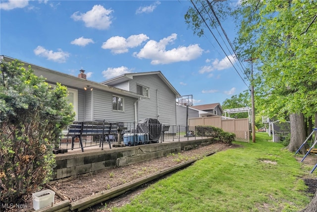 3226 Woodlawn Dr, Parma, OH 44134 - back of house with a patio and a chimney