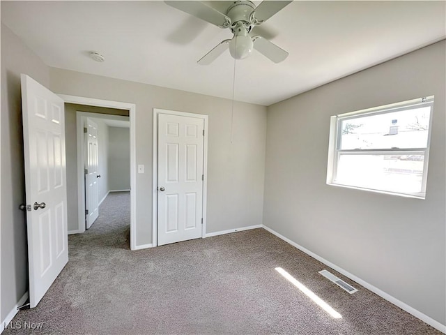 1400 Yale Dr, Brunswick, OH 44212 - unfurnished bedroom featuring carpet, baseboards, and ceiling fan