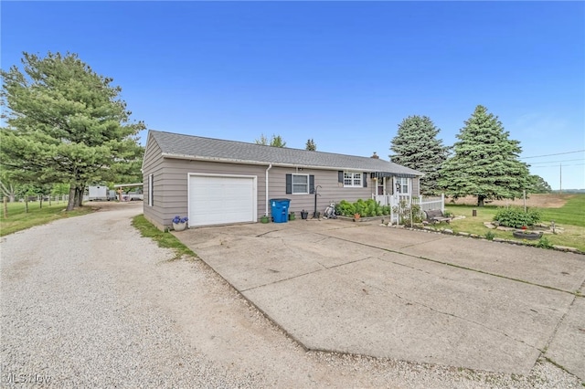 6395 Easton St NE, Louisville, OH 44641 - ranch-style home with a garage and concrete driveway