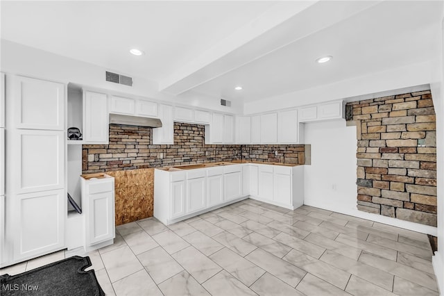 6395 Easton St NE, Louisville, OH 44641 - kitchen featuring under cabinet range hood, decorative backsplash, white cabinets, and recessed lighting