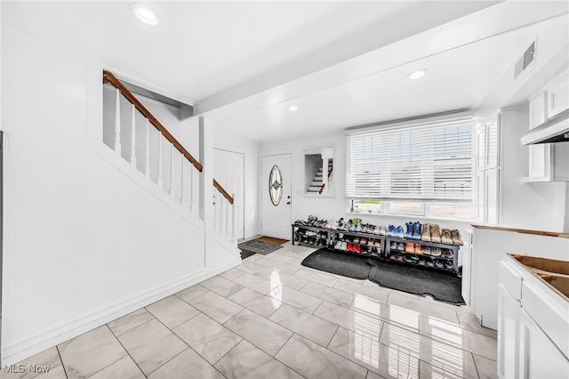 6395 Easton St NE, Louisville, OH 44641 - foyer with stairway and recessed lighting