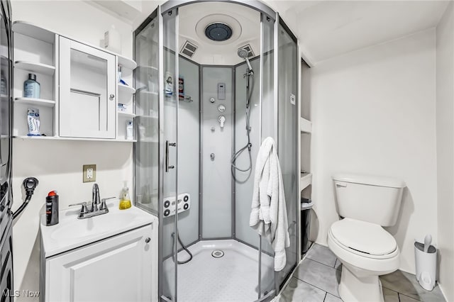6395 Easton St NE, Louisville, OH 44641 - bathroom with a stall shower, vanity, toilet, and tile patterned flooring