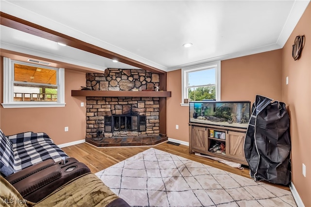 6395 Easton St NE, Louisville, OH 44641 - living room with wood finished floors, baseboards, a fireplace, and recessed lighting