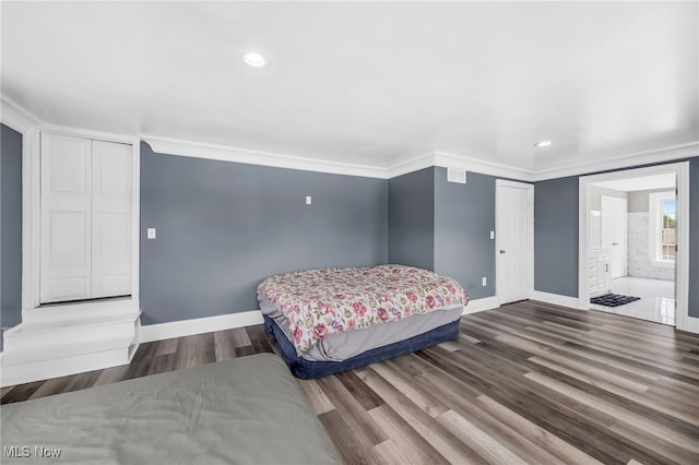 6395 Easton St NE, Louisville, OH 44641 - bedroom with baseboards, wood finished floors, recessed lighting, ensuite bathroom, and crown molding