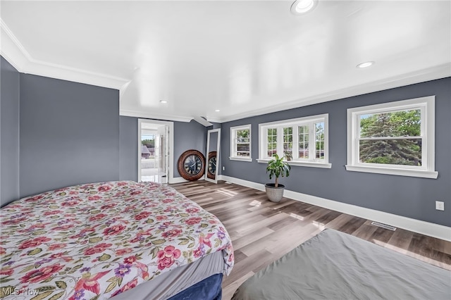 6395 Easton St NE, Louisville, OH 44641 - bedroom with crown molding, baseboards, wood finished floors, and recessed lighting