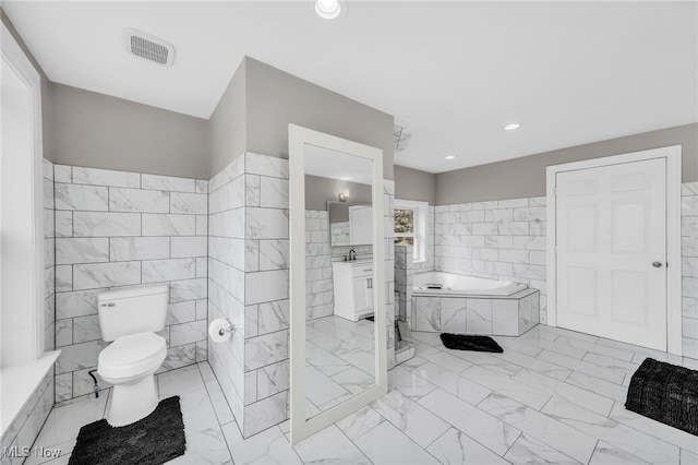6395 Easton St NE, Louisville, OH 44641 - bathroom with tile walls, a bath, toilet, marble look tiles, and recessed lighting