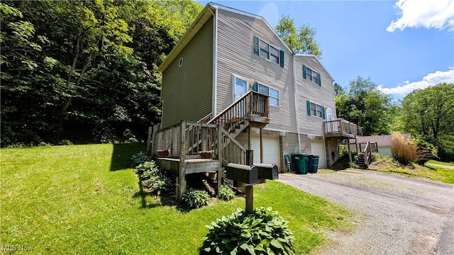 33-37 Alaska Ave, Chester, WV 26034 - view of front of property featuring stairs, an attached garage, gravel driveway, and a front yard