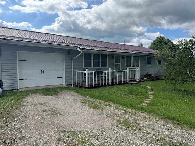 61272 Salem Rd, Salesville, OH 43778 - view of front of home featuring dirt driveway, a garage, covered porch, and metal roof