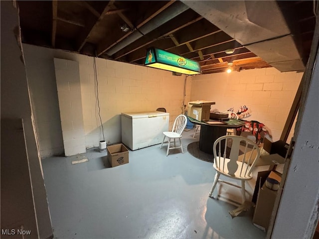 61272 Salem Rd, Salesville, OH 43778 - unfinished below grade area featuring refrigerator and concrete block wall