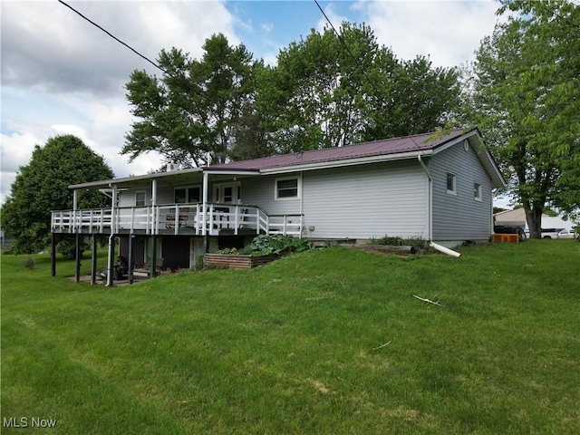 61272 Salem Rd, Salesville, OH 43778 - back of property with a yard, a deck, and metal roof