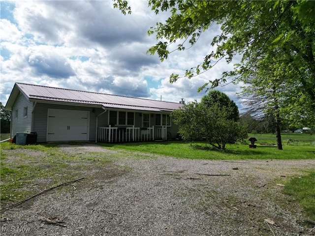 61272 Salem Rd, Salesville, OH 43778 - view of front of property with an attached garage, driveway, metal roof, a porch, and a front lawn