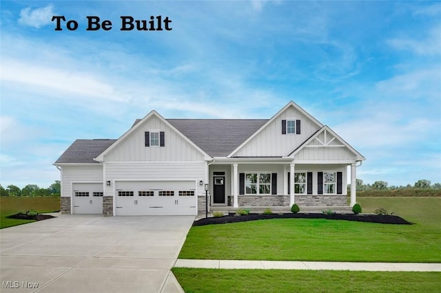 3186 Stoneleigh Rd NE, Canton, OH 44721 - view of front of property with board and batten siding, stone siding, driveway, and a front lawn
