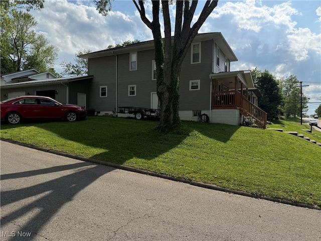 1710 Clairmont Ave, Cambridge, OH 43725 - view of side of home featuring a yard and stairway