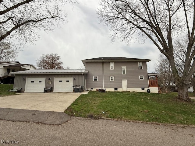 1710 Clairmont Ave, Cambridge, OH 43725 - view of side of home with an attached garage, driveway, a lawn, and metal roof