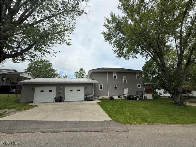 1710 Clairmont Ave, Cambridge, OH 43725 - view of front of house with driveway, a front lawn, an attached garage, metal roof, and central AC unit