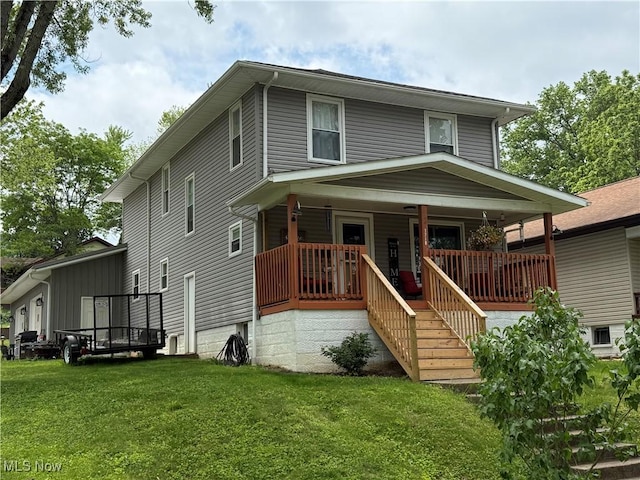 1710 Clairmont Ave, Cambridge, OH 43725 - american foursquare style home with a front lawn, covered porch, and stairs
