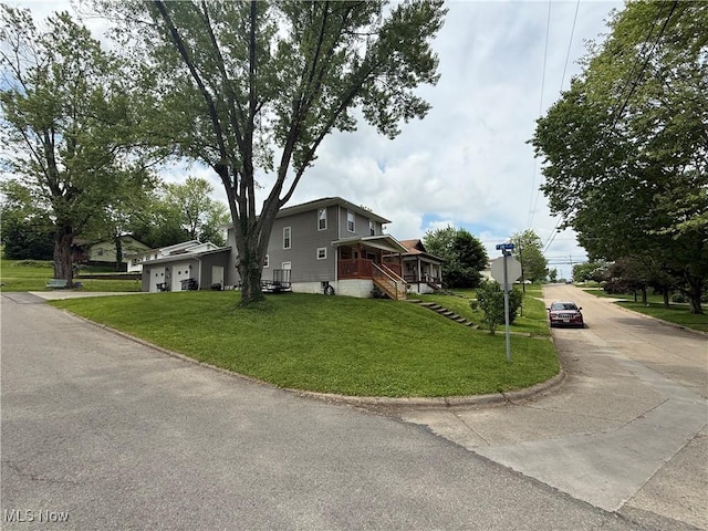 1710 Clairmont Ave, Cambridge, OH 43725 - view of side of home with driveway, a lawn, and an attached garage