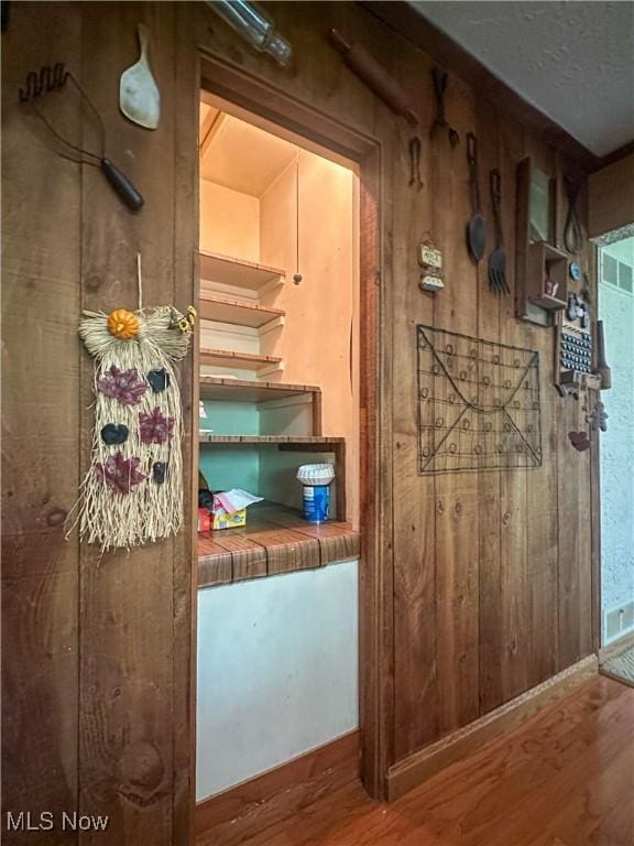 1010 Park Cir, Girard, OH 44420 - detailed view of wood finished floors and wood walls