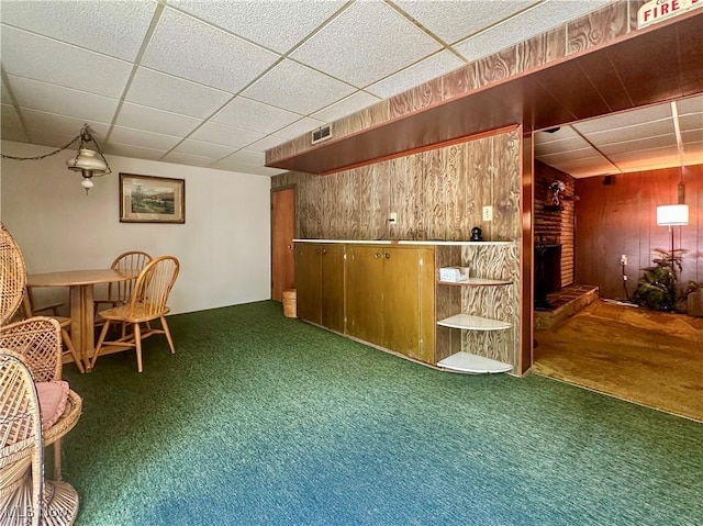 1010 Park Cir, Girard, OH 44420 - bar with carpet, wood walls, a fireplace, and a drop ceiling