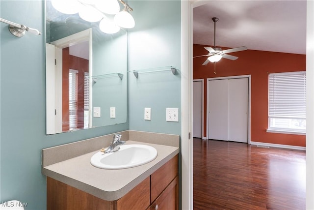 3602 Marvin Ave, Cleveland, OH 44109 - bathroom with lofted ceiling, wood finished floors, a ceiling fan, and vanity