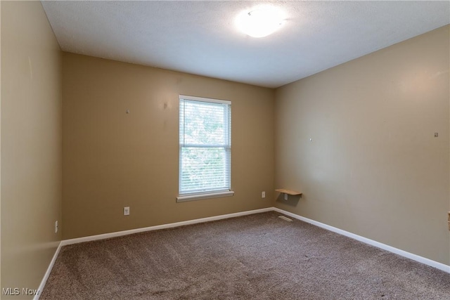3602 Marvin Ave, Cleveland, OH 44109 - spare room featuring carpet floors and baseboards